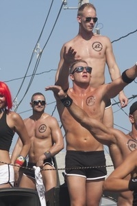 42 Below vodka float, with buff young men and women in skimpy outfits : Provincetown Carnival parade