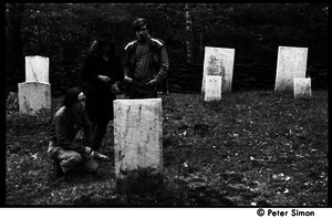 Raymond Mungo, Michelle Clarke, and Marty Jezer (l. to r.) looking at gravestones in a cemetery