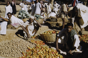 Men sell potatoes and tomatoes in the market in Ranchi