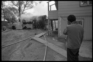 Man in anguish after learning that his garage was gutted by fire, and the family's cat was trapped inside