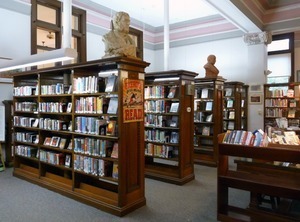 Belding Memorial Library: interior with bookcases and busts