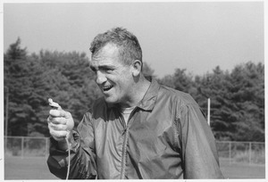 Richard Fredrick MacPherson holding whistle on football field