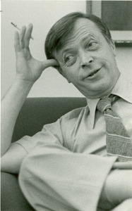 David C. Knapp seated indoors with cigarette