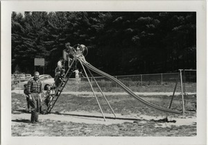 Children playing on a slide at the picnic, Pine Beach