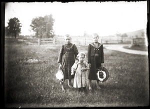 Portrait of three children in a field (Greenwich, Mass.)