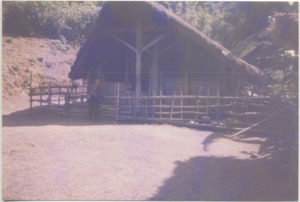 A photograph of a traditional Kachin house, 1999
