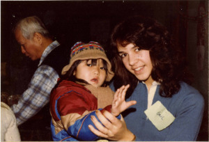 Photograph of a woman and child at a Christmas and New Year celebration, [1982-1983].