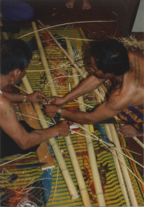 Kite Making: Soeun Tim and Tim Sao join the slats, 1987