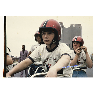 Boys on bikes with red helmets and YMCA Southwest Branch shirts