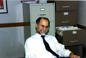 Suffolk University Professor Joseph Glannon (Law) seated behind desk