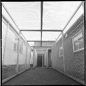 RUC station, Castlereagh, Belfast. Notorious for being the place in which many IRA prisoners were interrogated.  Known commonly as the Castlereagh Holding Centre. Bobbie was the only photographer allowed into the building to take photographs before it was demolished. Exercise cages for prisoners