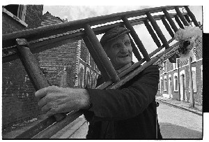 Window cleaner on the Shankill Road, Belfast. Various shots with ladder and bucket