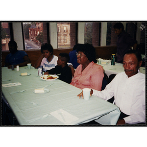 Two men, two women, and a boy seated at a table at the Best-Year-In-School-Ever Recognition Dinner in Roxbury, Boston