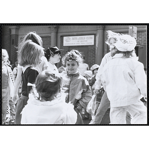 A group of girls stand in front of the Eben D. Jordan Memorial Building at the Boys and Girls Clubs of Boston 100th Anniversary Celebration Street Fair