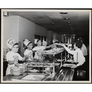 Members of the Tom Pappas Chefs' Club serve students in a Brandeis University dining hall