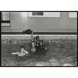 Children swim in a natorium pool