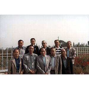 Ten Association members stand together in a botanical garden in Hankou, China