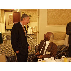 Two men talking at the College of Business Administration's CEO Breakfast Forum