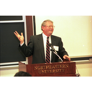 Neal Finnegan, Chairman of the Board of Trustees of Northeastern University, speaks at the 75th Anniversary Symposium of the College of Business Administration