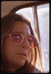 Judy Collins: portrait in rose-colored glasses, seated in the back of car