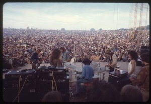 Jefferson Airplane performing at Woodstock, with audience in background