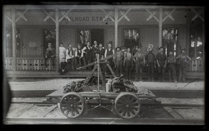 Hand car and rail workers at Lake Pleasant (?) railroad station