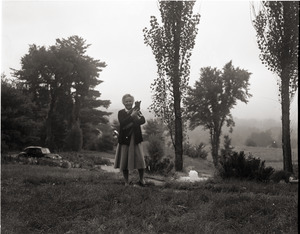 Dorothy Canfield Fisher: Fisher standing in a field, holding her cat