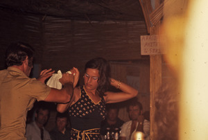 Dancing man and woman at a discotheque