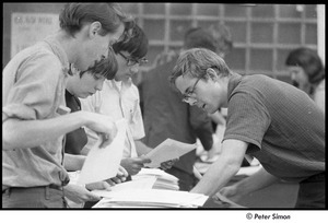 United States Student Press Association Congress: attendees looking through stacks of paper