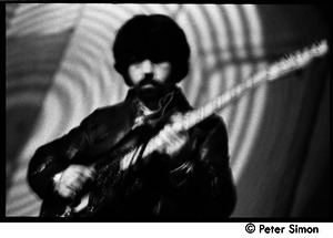 The Byrds and Flying Burrito Brothers performing at the Boston Tea Party: Clarence White playing guitar (partial double exposure)