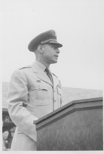 Colonel John Chesley Marchant standing at podium