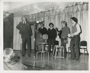 Actor Ken Howard on stage with band at Thanksgiving celebration