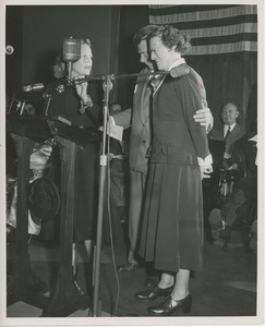 Mrs. Margaret Milbank Bogert and Arthur Godfrey on stage with an unidentified client at Institute Day