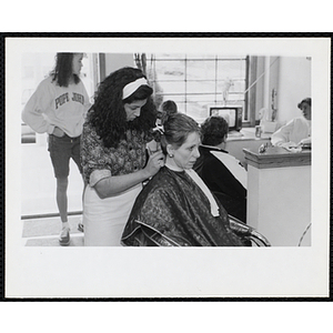 A hairdresser and her client in a hair salon