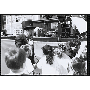 Boston magician Peter O'Malley entertains children at the Boys and Girls Clubs of Boston 100th Anniversary Celebration Street Fair