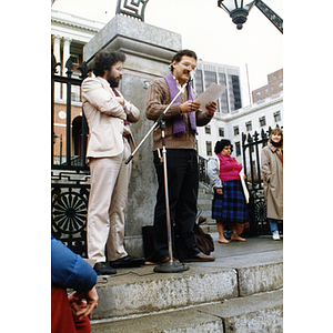 Speaker outside the Massachusetts State House at a rally for bilingual education in schools