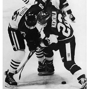 Dave Buda facing off against Boston University's Ville Kentala