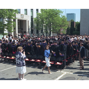 Students stand in rows during Law School commencement