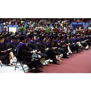 Law School graduates seated at commencement in Matthews Arena