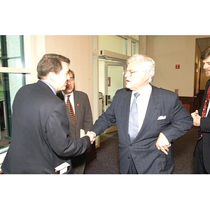 U.S. Senator Edward Kennedy (D-MA) shakes hands with an attendee at a press conference on student aid