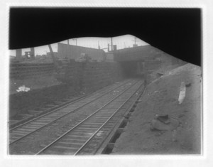 View of tracks going under a bridge