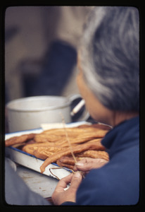 Woman and fried dough