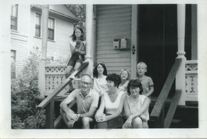 Sidney and Joann Lipshires (center, bottom) on porch with family