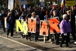 Protesters holding letters spelling out 'No war': rally and march against the Iraq War