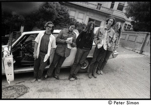 Five friends standing next to a parked car on a hilly street: Verandah Porche (second from left)