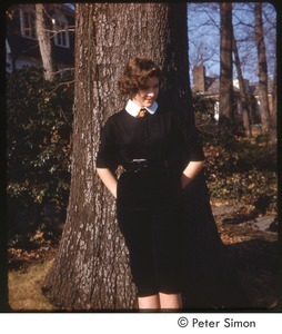 Lucy Simon posing in front of a tree