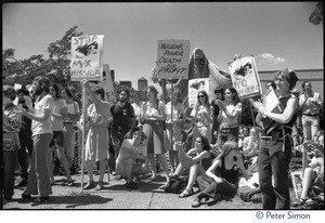 Protesters at a Mobilization for Survival antinuclear demonstration near Draper Laboratory, MIT, carrying signs opposing the MX missile and nuclear power