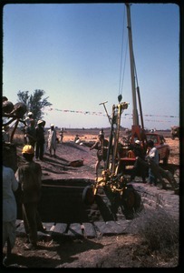 Lowering a pump into a large water well