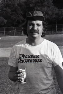 Boston Phoenix vs. WBCN staff softball game: Harper Barnes holding a beer