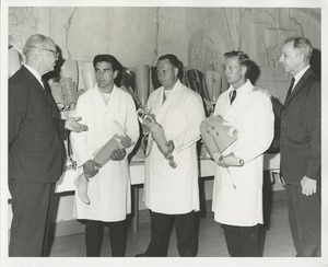 James Burrows and another man stand with 1964 Prosthetics and Orthotics training graduates